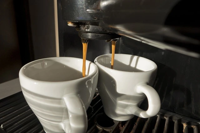 coffee from a coffee machine in white cups